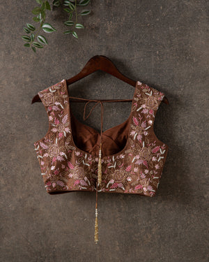 Pastel Pink Floral Georgette saree with contemporary sleeveless blouse