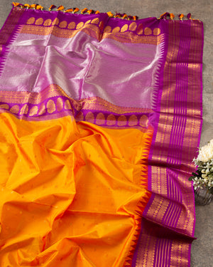 Tangerine Orange Gadwal Silk saree with a Purple Border