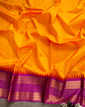 Tangerine Orange Gadwal Silk saree with a Purple Border