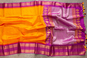 Tangerine Orange Gadwal Silk saree with a Purple Border