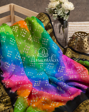 Rainbow hued Black Bandini saree with kanchi border