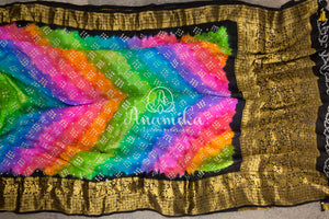 Rainbow hued Black Bandini saree with kanchi border