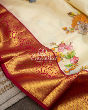 Off white Floral Kanchipattu saree with contrast wine border