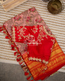 Pink Floral Kanchipattu saree with contrast red zardosi work blouse