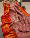 Pink Floral Kanchipattu saree with contrast red zardosi work blouse