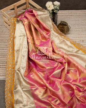 Pastel Pink Kanchipattu saree with yellow maggam work border