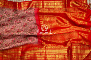 Pink Floral Kanchipattu saree with contrast red zardosi work blouse