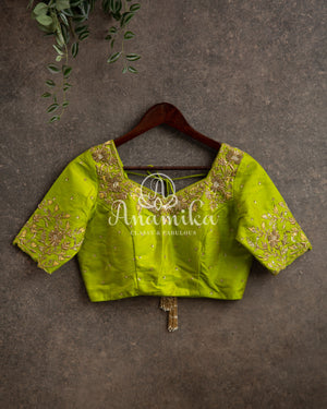 Yellow Banarasi saree with parrot green maggam work border