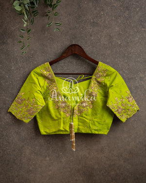 Yellow Banarasi saree with parrot green maggam work border