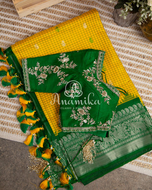 Lovely Yellow Gadwal pattu saree with contrast dark green border