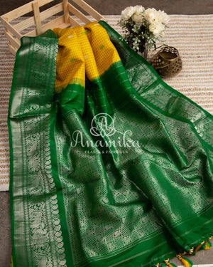 Lovely Yellow Gadwal pattu saree with contrast dark green border