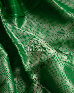 Lovely Yellow Gadwal pattu saree with contrast dark green border