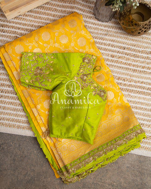 Yellow Banarasi saree with parrot green maggam work border