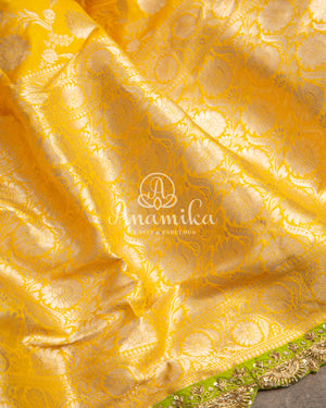 Yellow Banarasi saree with parrot green maggam work border