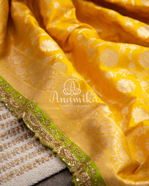 Yellow Banarasi saree with parrot green maggam work border