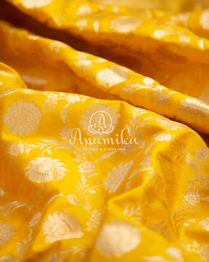 Yellow Banarasi saree with parrot green maggam work border