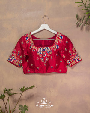 Dark reddish pink blouse with cutdana and thread work