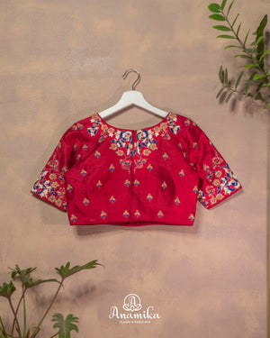 Dark reddish pink blouse with cutdana and thread work