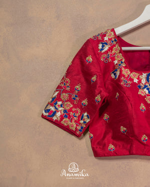 Dark reddish pink blouse with cutdana and thread work