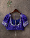 Green Checkered Gadwal Pattu saree with a contrast dark blue puff sleeves blouse