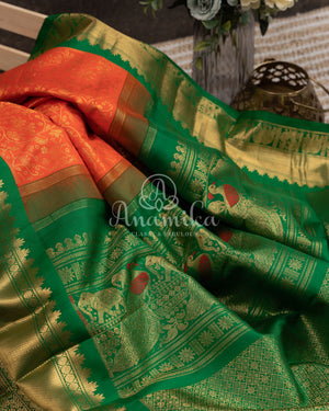 Gadwal Kanchi saree in Orange with beautiful green border and pallu