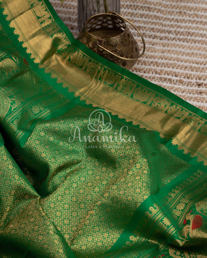 Gadwal Kanchi saree in Orange with beautiful green border and pallu