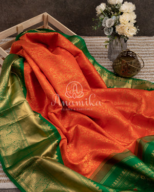 Gadwal Kanchi saree in Orange with beautiful green border and pallu