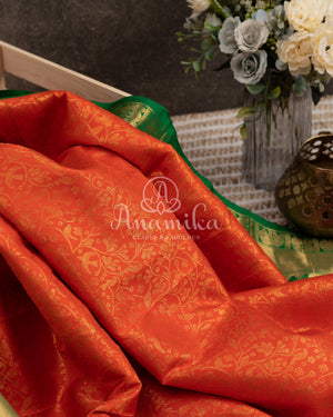 Gadwal Kanchi saree in Orange with beautiful green border and pallu