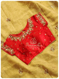 Classic gold tissue saree enhanced with hand work buttis