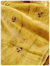 Classic gold tissue saree enhanced with hand work buttis