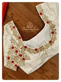 Off white Blouse with gold zari and red thread work