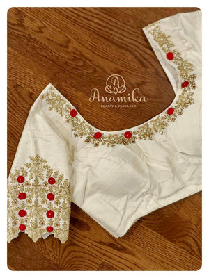 Off white Blouse with gold zari and red thread work