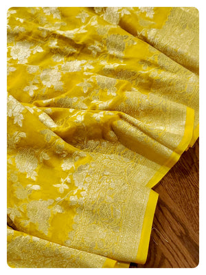 Yellow Banarasi Georgette Saree with a net based blouse