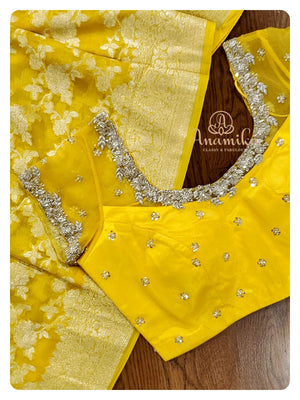 Yellow Banarasi Georgette Saree with a net based blouse
