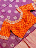 Purple Venkatagiri Pattu Saree with Orange Border, paired with contrast orange ikkat blouse