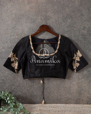 Tussar silk saree paired with a beautiful contrast black blouse