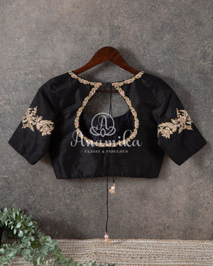 Tussar silk saree paired with a beautiful contrast black blouse