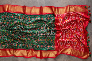 Dark Green Ikkat Patola saree with contrast off white blouse
