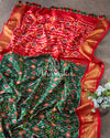Dark Green Ikkat Patola saree with contrast off white blouse