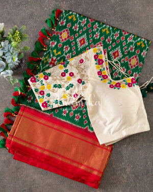 Dark Green Ikkat Patola saree with contrast off white blouse
