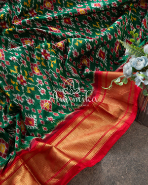 Dark Green Ikkat Patola saree with contrast off white blouse