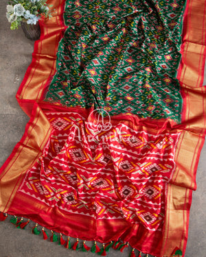 Dark Green Ikkat Patola saree with contrast off white blouse