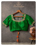 Green blouse with multi color thread and zardosi work