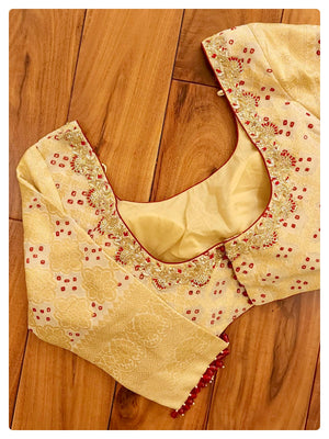 Off white georgette blouse with red real bandini with embroidery and fancy beads on sleeves