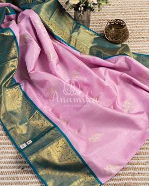 Pastel Pink Kanchipattu saree with contrast teal blue border