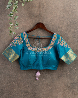 Pastel Pink Kanchipattu saree with contrast teal blue border