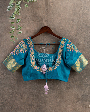 Pastel Pink Kanchipattu saree with contrast teal blue border