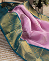 Pastel Pink Kanchipattu saree with contrast teal blue border