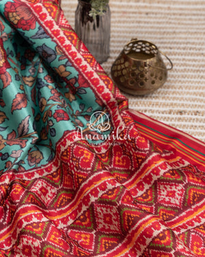 Blue Kalamkari Digital Print on crepe silk with a beautifully designed red blouse