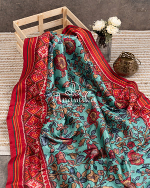 Blue Kalamkari Digital Print on crepe silk with a beautifully designed red blouse